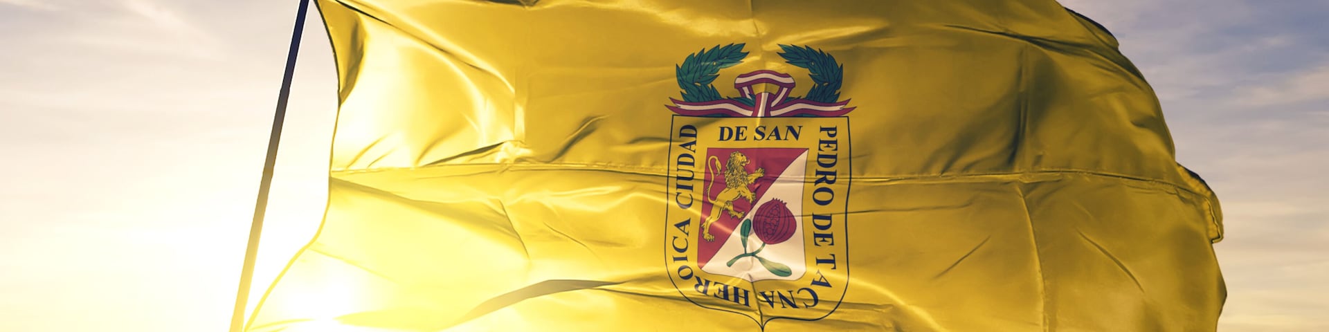 Tacna of Peru flag waving on the top sunrise mist fog