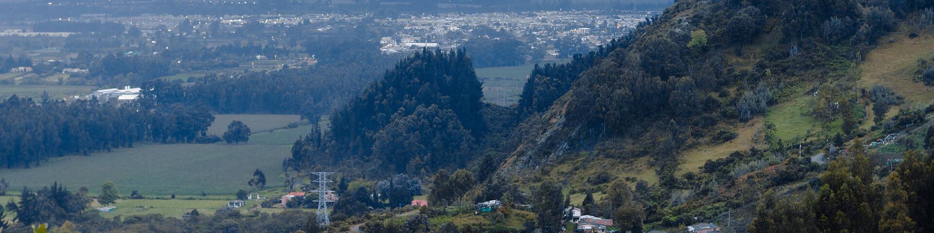 Evening Panorama of Chía, Chia, Cundinamarca, Colombia. Serene View of Town with Overcast Sky and Lush Greenery