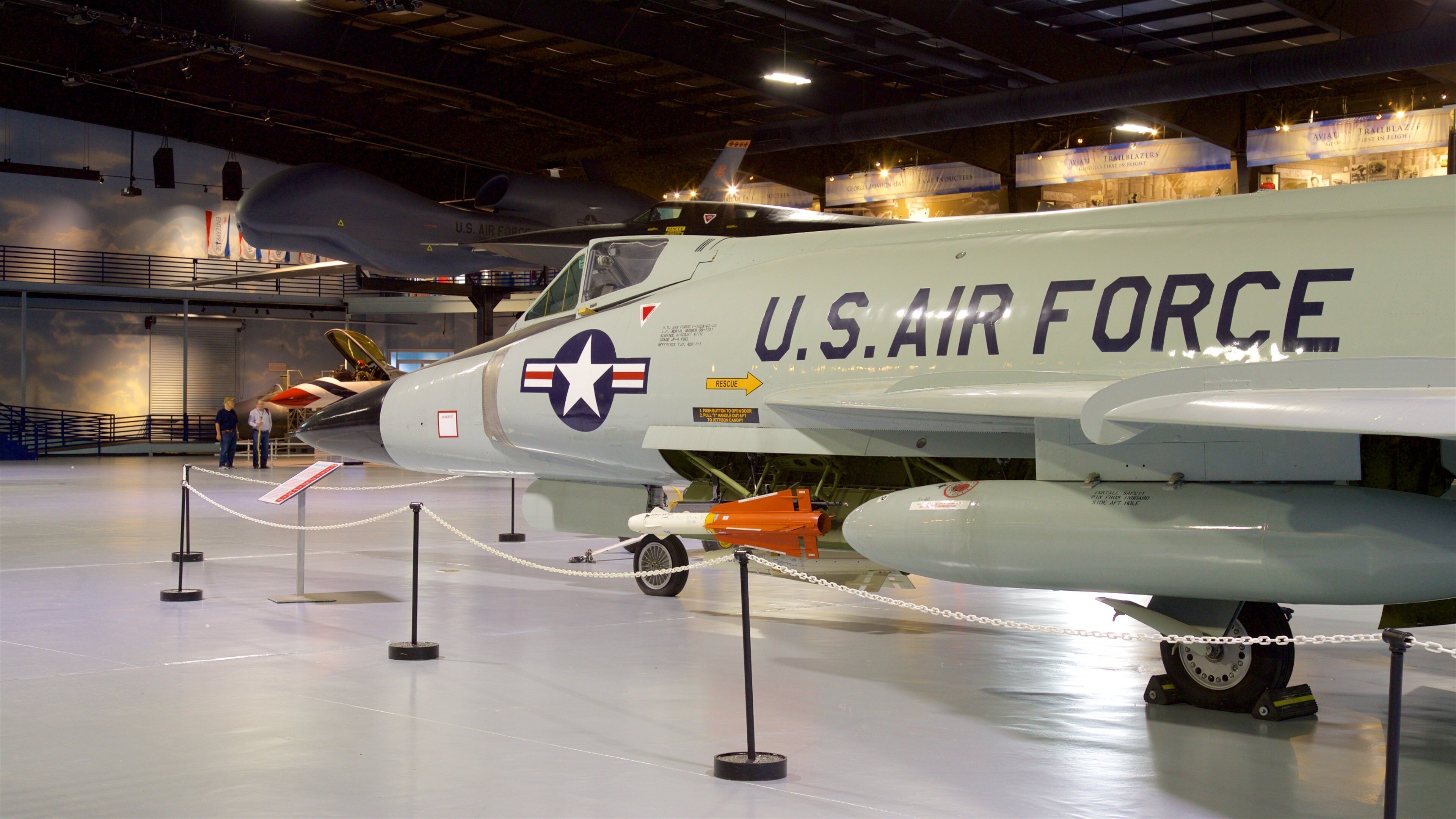 A U.S. Air Force aircraft on display with a rescue arrow sign.