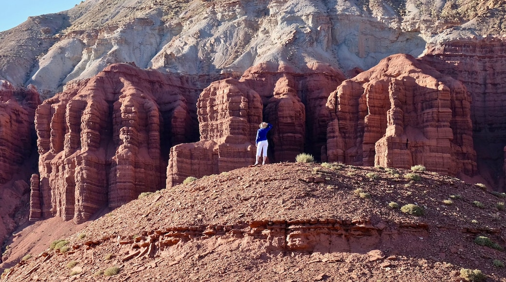 Young woman meditating in rock desert. Capitol Reef National Park. Kanab. Escalante. Utah. United States.