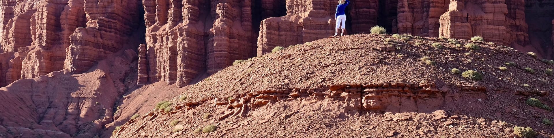 Young woman meditating in rock desert. Capitol Reef National Park. Kanab. Escalante. Utah. United States.
