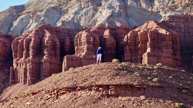 Young woman meditating in rock desert. Capitol Reef National Park. Kanab. Escalante. Utah. United States.