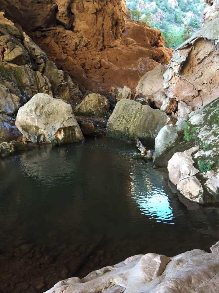 This serene pool, tucked under the Tonto Natural Bridge, reflects the wavering image of a hot summer's day in Arizona.