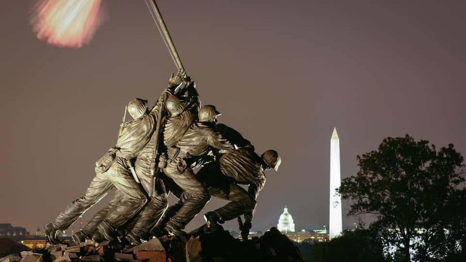 Arlington featuring a statue or sculpture and night scenes