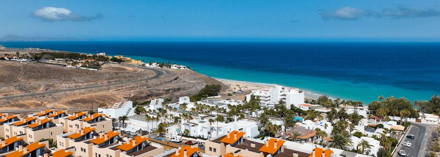 A town with white houses, hotels alond the coast of Atlantic ocean.