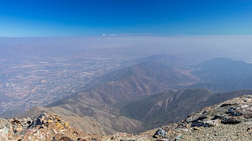 Mountain summit view with landscape of Andes and Aconcagua on clear day in La Campana National park in central Chile, South America