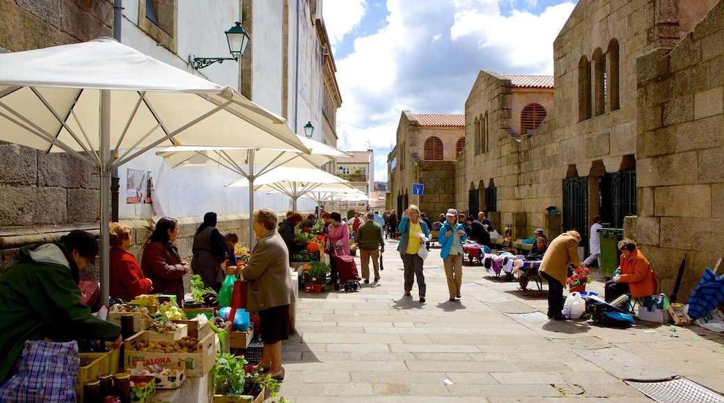 Mercado de Abastos de Santiago which includes street scenes, markets and food