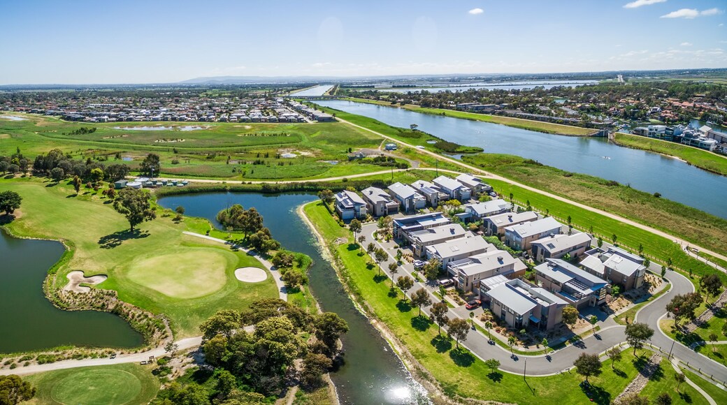 Aerial panorama of Patterson River, Bonbeach suburb, and golf club on bright sunny day. Melbourne, Australia