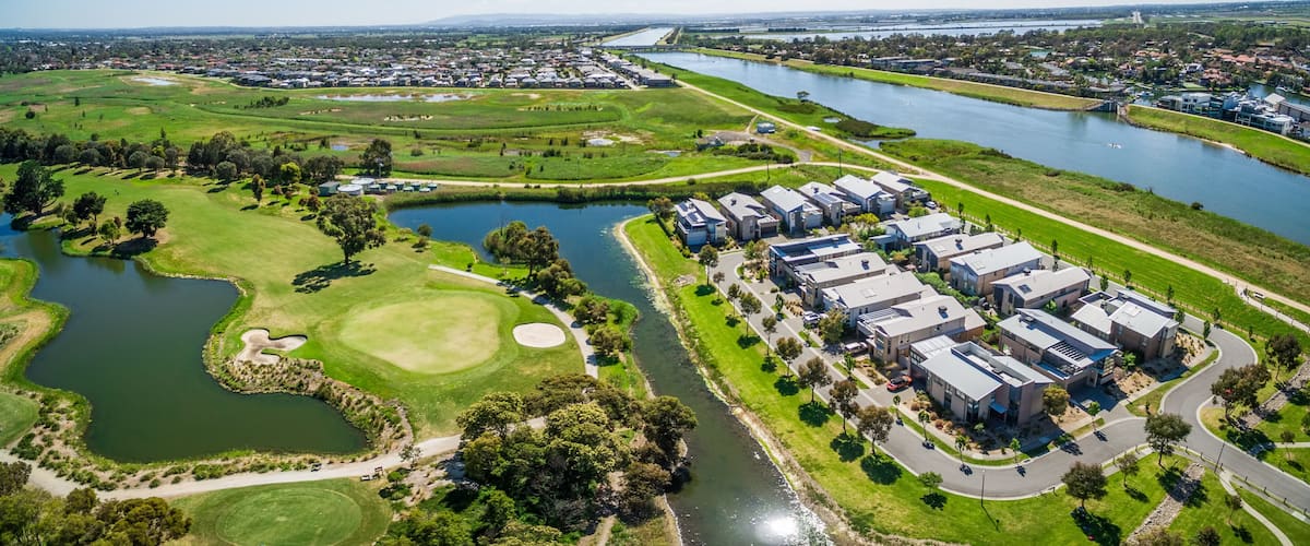 Aerial panorama of Patterson River, Bonbeach suburb, and golf club on bright sunny day. Melbourne, Australia
