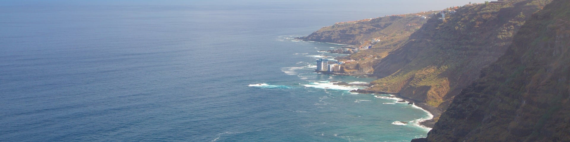 Sauzal which includes mountains, general coastal views and rocky coastline