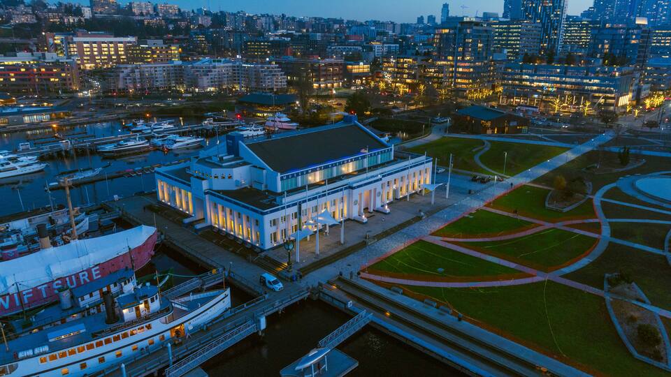 Seattle, United States - 04 December 2024: Aerial view of vibrant cityscape with MOHAI and marina at twilight, South Lake Union, Seattle, United States.