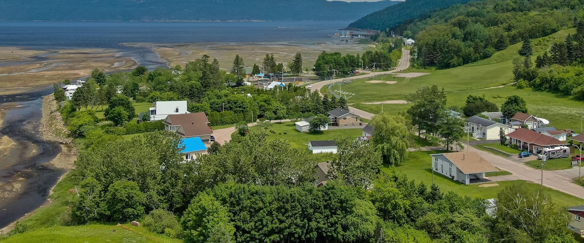 L\'Anse-Saint-Jean which includes a small town or village and landscape views