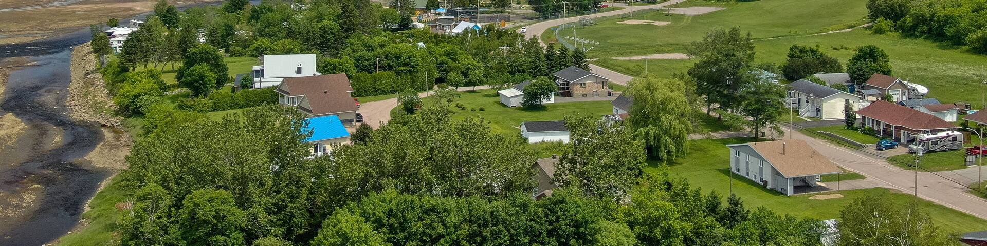 L\'Anse-Saint-Jean which includes a small town or village and landscape views