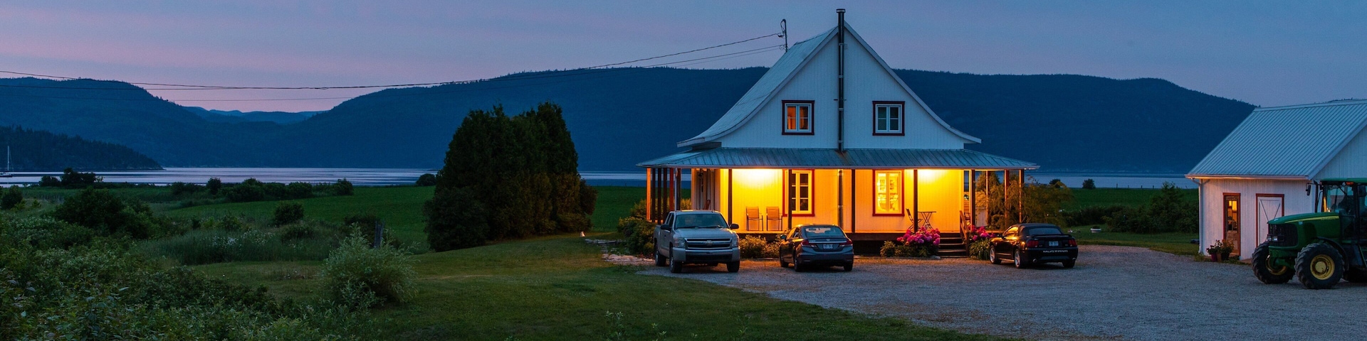 L\'Anse-Saint-Jean which includes a small town or village and night scenes