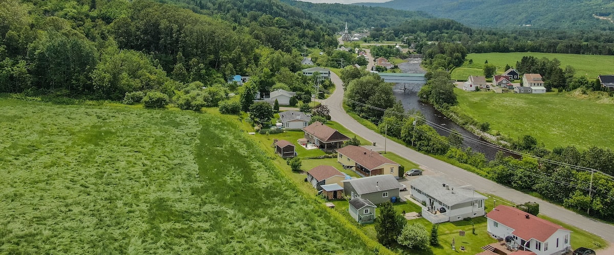 Petit-Saguenay which includes landscape views, tranquil scenes and a small town or village