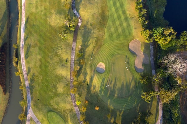 Aerial view of the green golf course in Thailand.