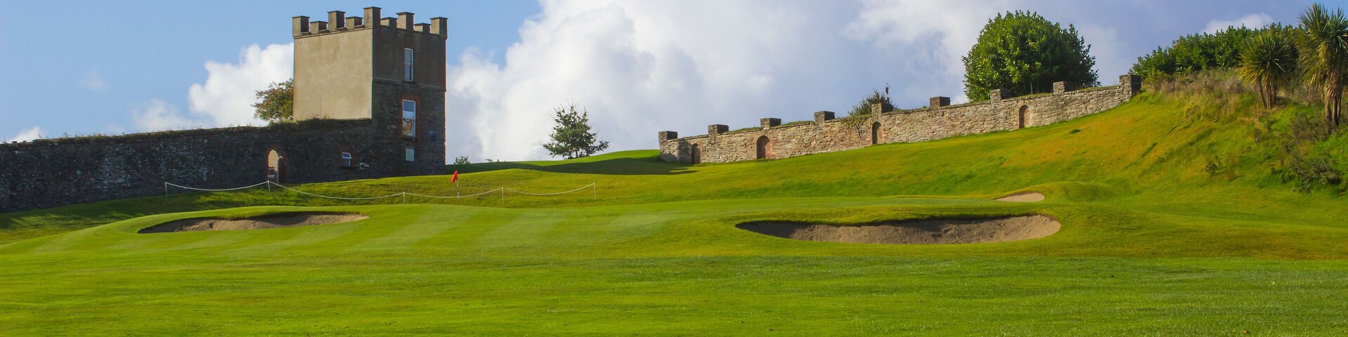 A golf fairway and green in the parkland course in the Roe river valley near Limavady in Northern Ireland