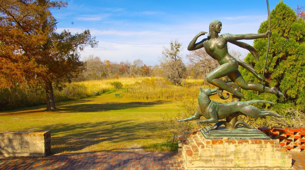 Sculpture of a running woman and dog at Brookgreen Gardens in South Carolina on a clear day