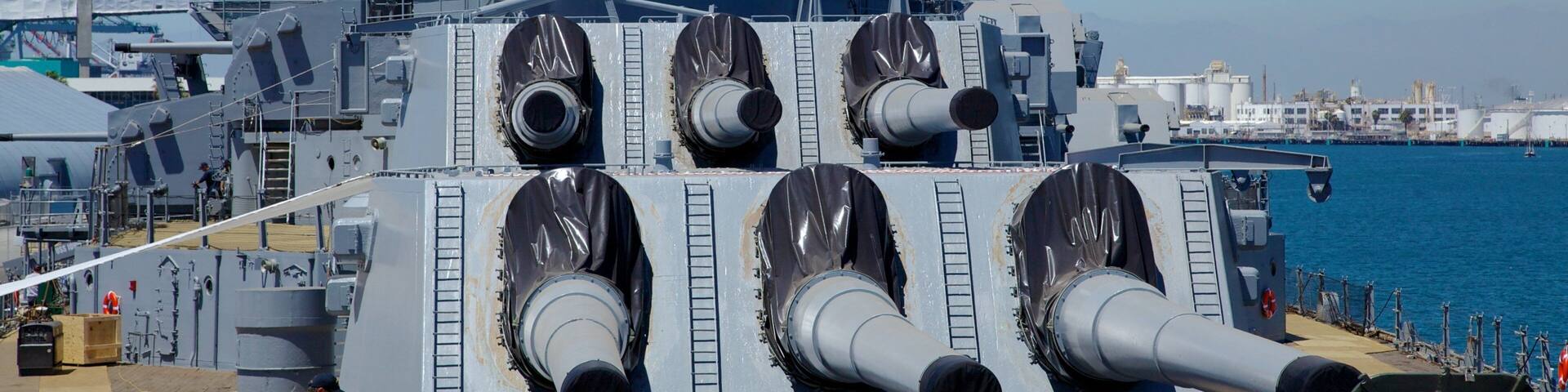 USS Iowa which includes a bay or harbour, military items and skyline