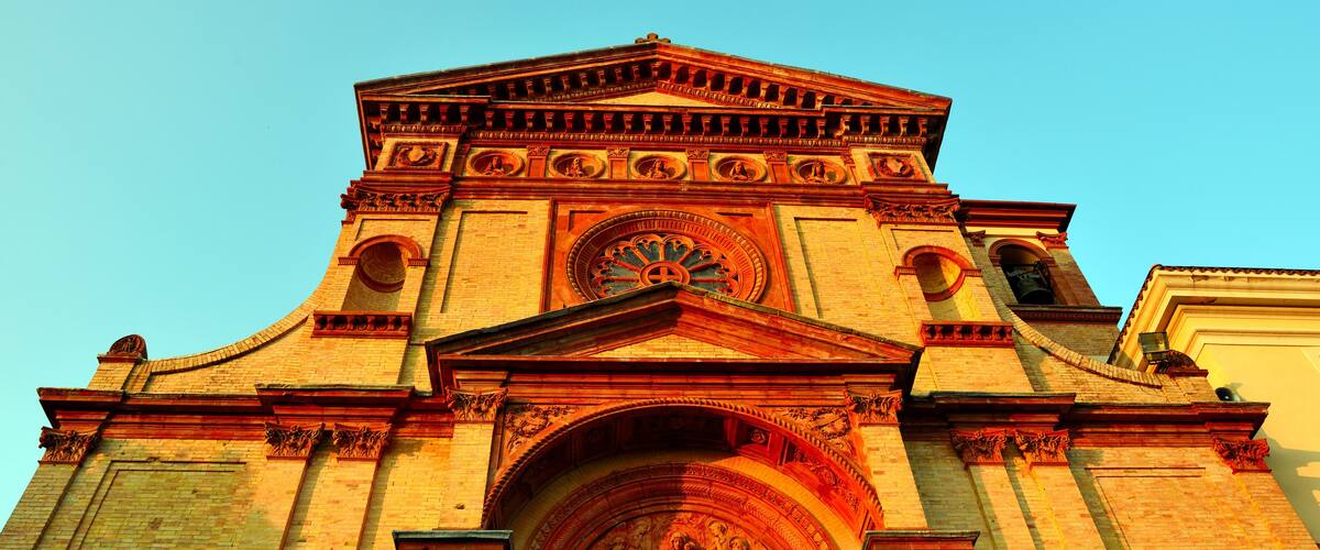 A large, ornate church with a prominent dome and detailed facade.