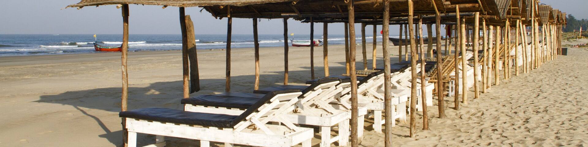 Shaded beach beds at Mandrem beach Pernem Goa, India
