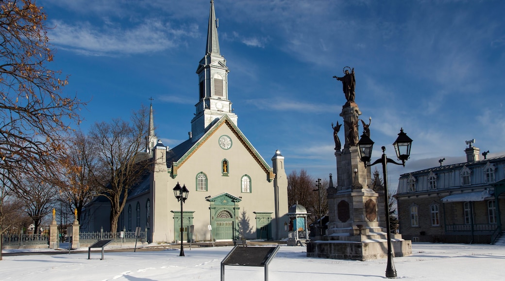Town square with large 1816 neoclassical St-Augustin Church, patrimonial presbytery and statue on stone pedestal, Saint-Augustin-de-Desmaures, Quebec, Canada
