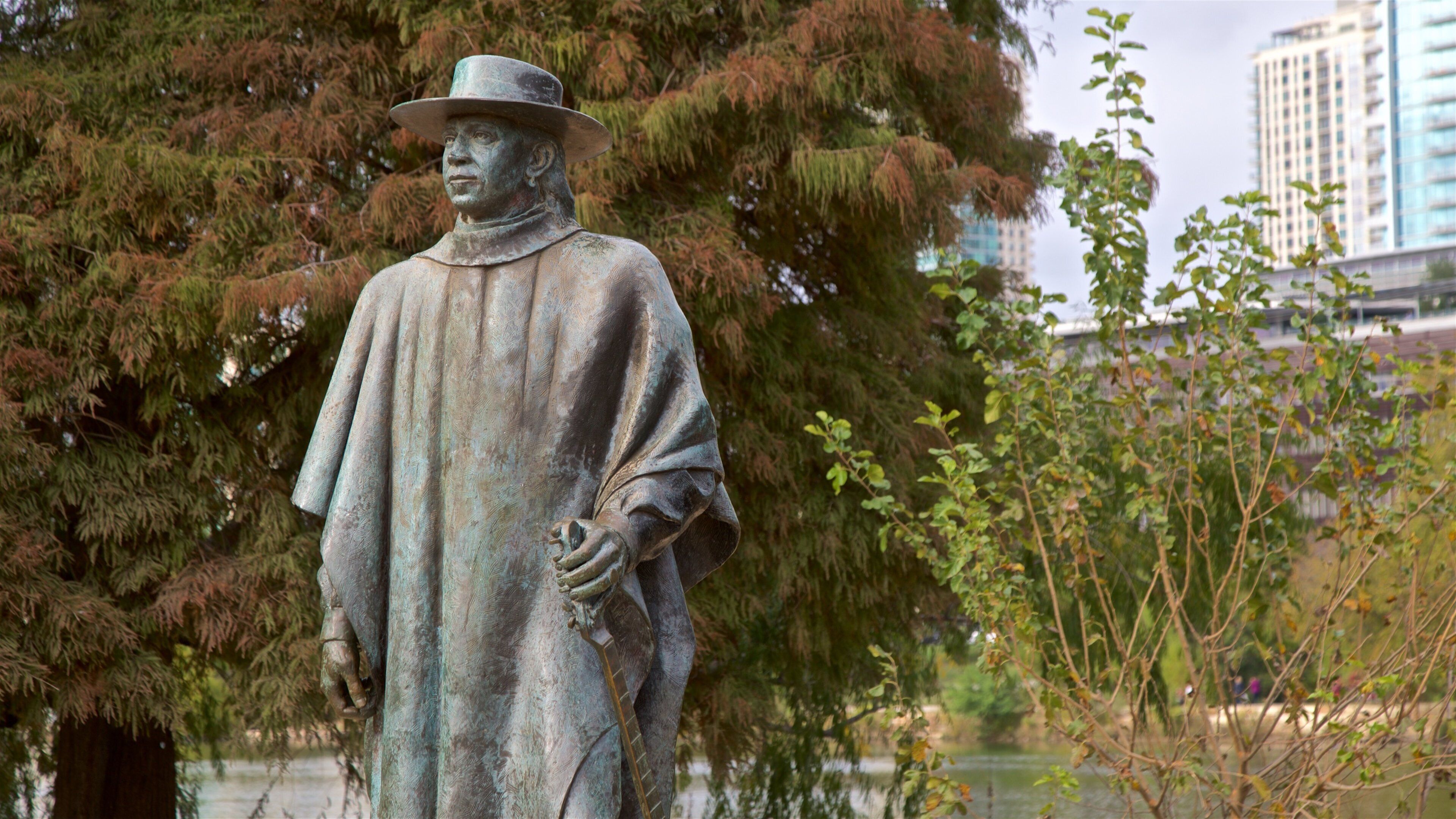 Stevie Ray Vaughan Statue featuring a statue or sculpture and a garden
