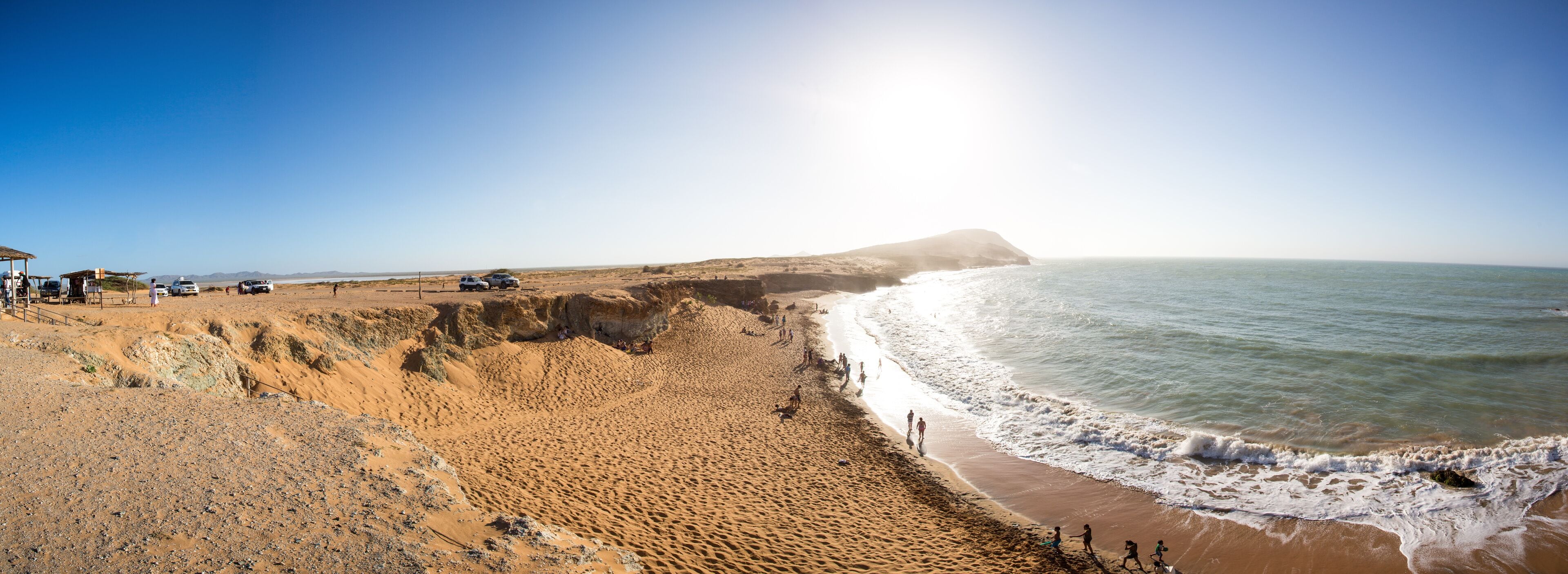 People having fun at a wild coastal beach in La Guajira