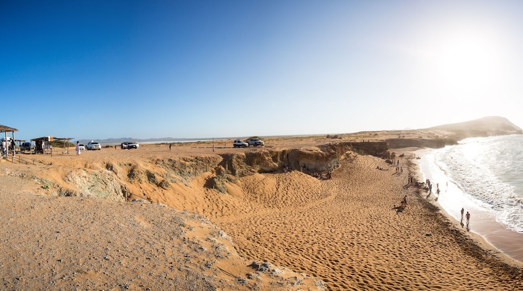People having fun at a wild coastal beach in La Guajira
