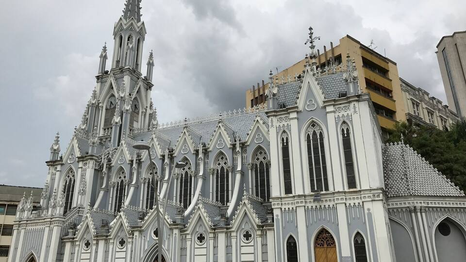 A Gothic-style church with intricate architecture and a clock tower.