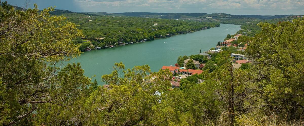 Mount Bonnell which includes a small town or village, landscape views and a river or creek