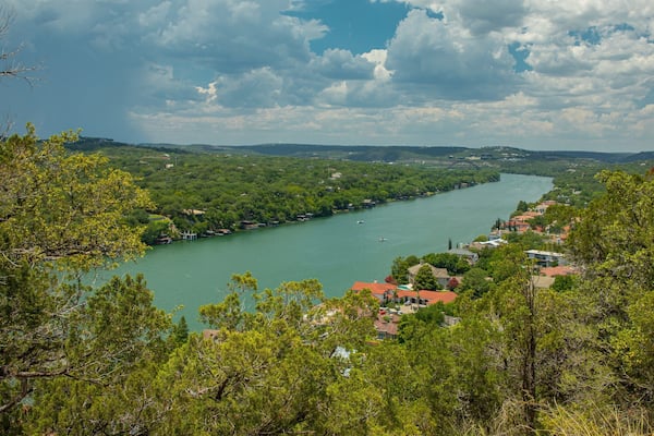 Mount Bonnell which includes a small town or village, landscape views and a river or creek