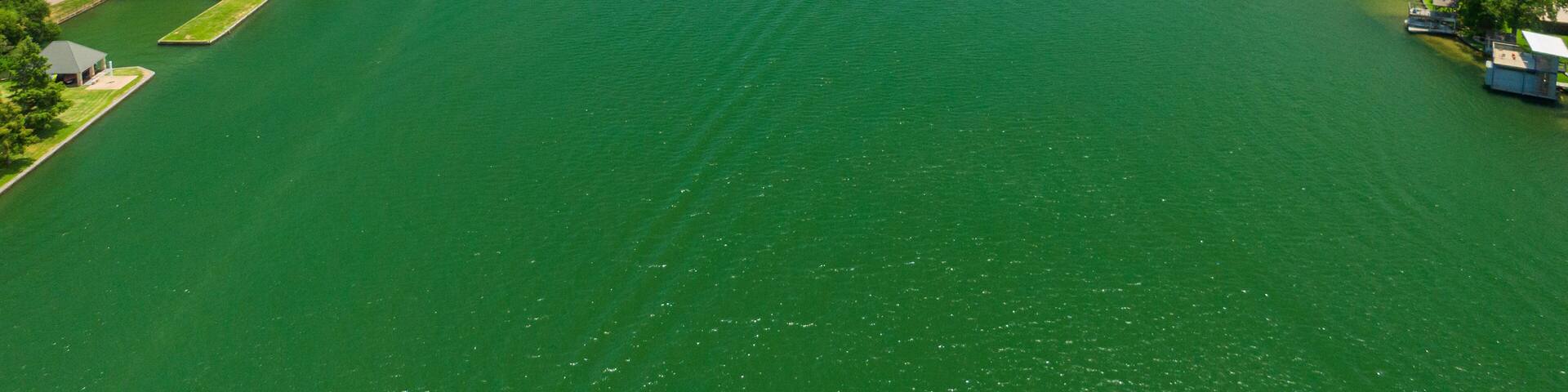 Mount Bonnell featuring a river or creek, landscape views and a small town or village