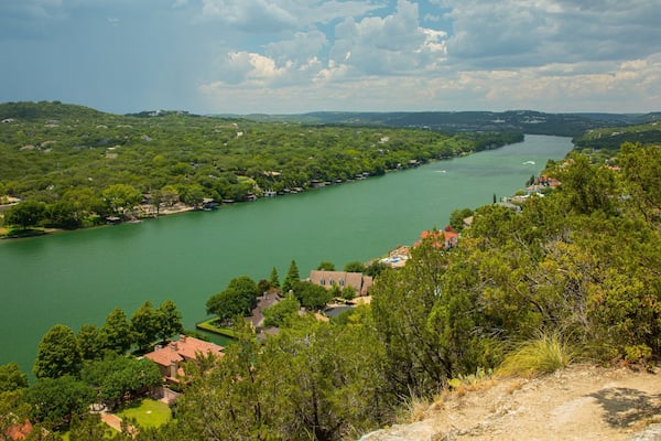 Mount Bonnell which includes landscape views, a small town or village and a river or creek