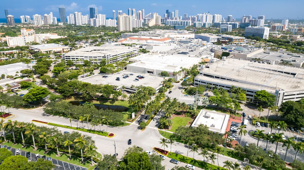 Aventura, Florida, USA - Aug 07, 2023: Aerial of Aventura Mall, with skyline of Sunny Isles Beach in the distance.