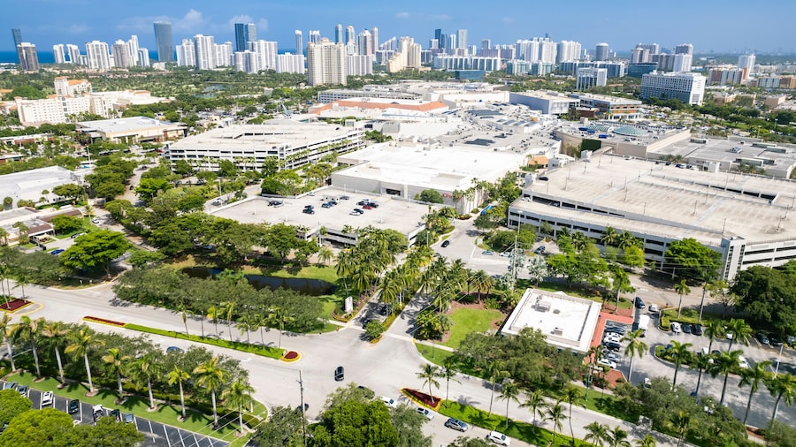 Aventura, Florida, USA - Aug 07, 2023: Aerial of Aventura Mall, with skyline of Sunny Isles Beach in the distance.