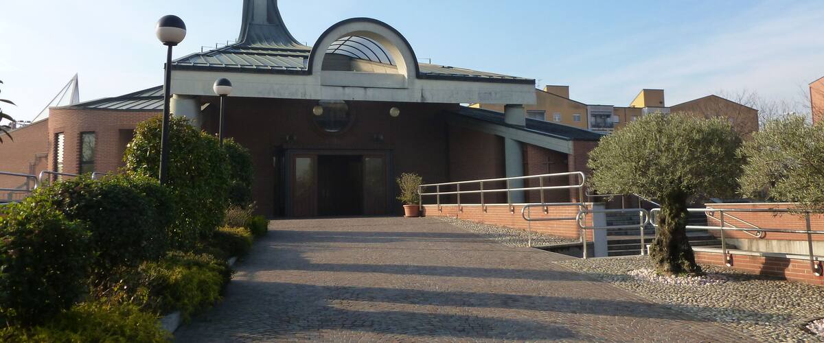 A church with a bell tower and a dome.