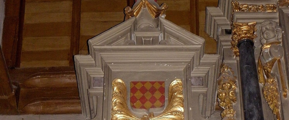 A detailed architectural model with ornate golden decorations, a central emblem, and marble columns.
