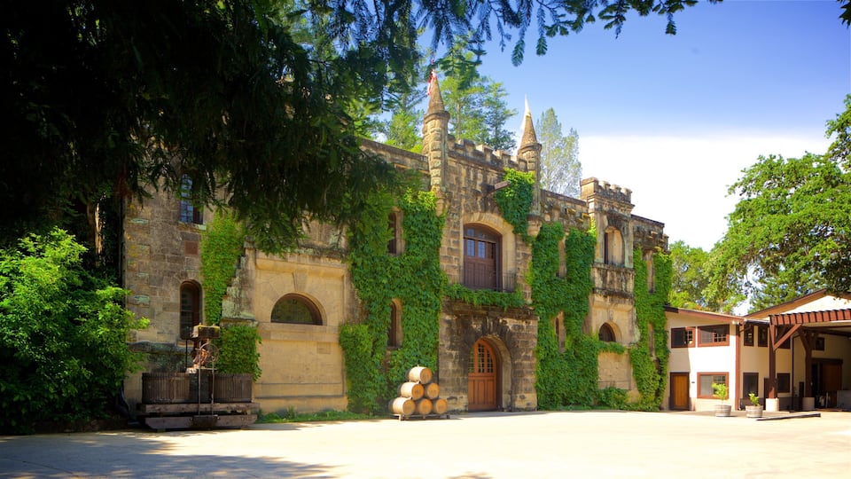 A historic building with ivy-covered walls and a stone tower.