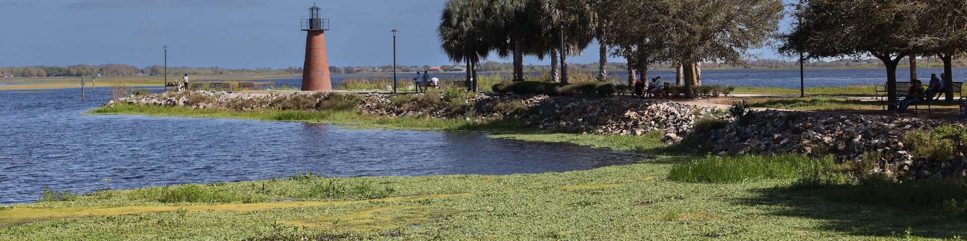 Kissimmee Lakefront Park Grassy waterfront park with walking paths, a fishing pier, picnic pavilions, and a shaded playground. children's playgrounds, splash pad