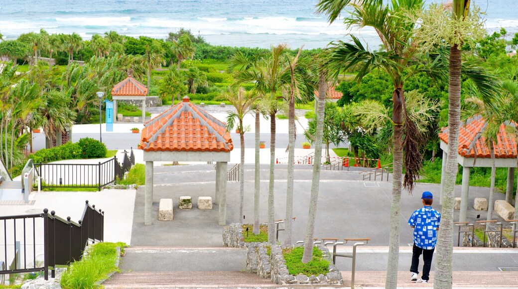 Ocean Expo minnepark som inkluderer kyst og tropisk landskap