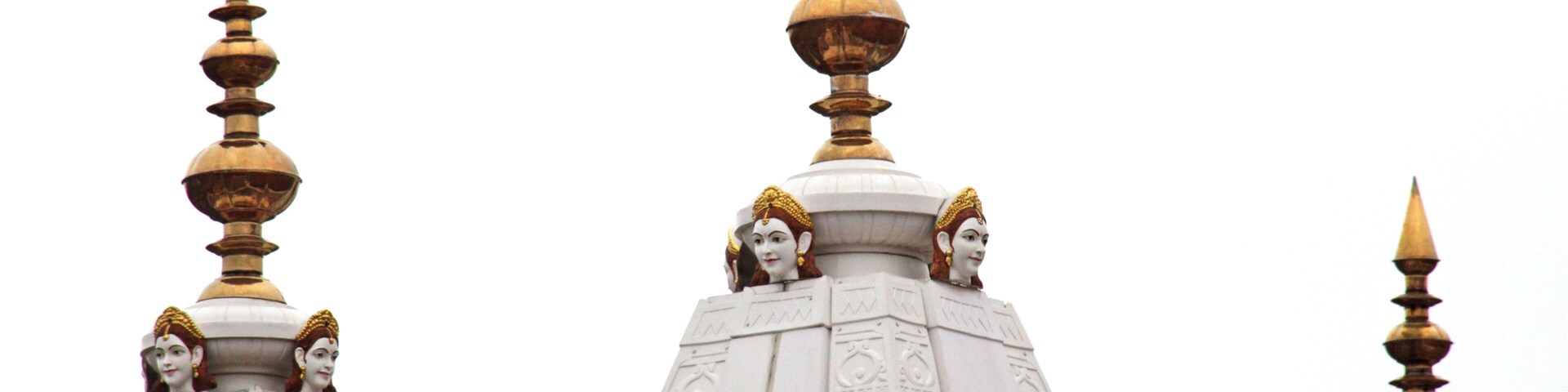A temple with ornate spires and golden finials.
