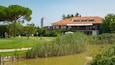 Adriatic Golf Club Cervia which includes a pond and golf