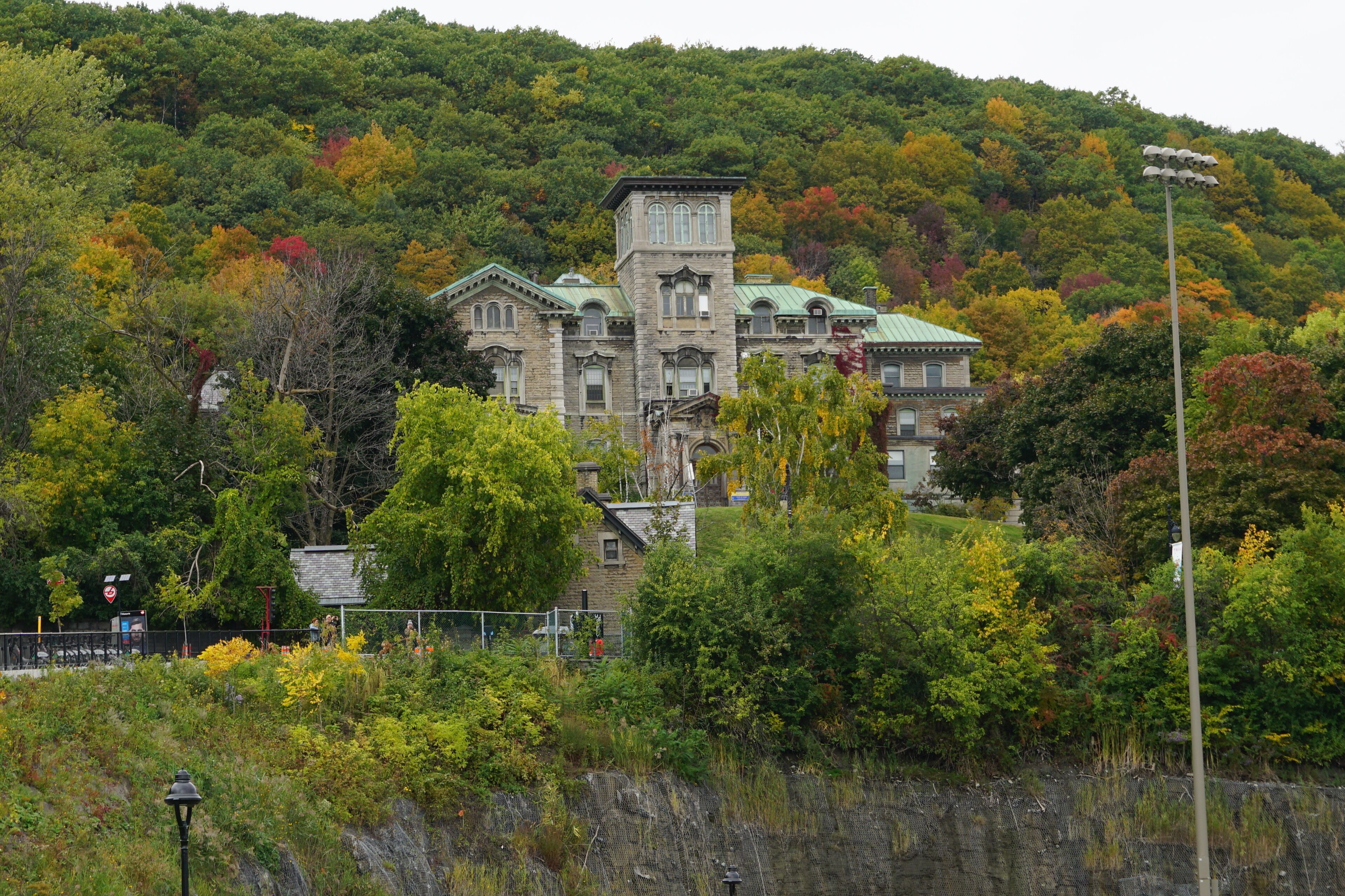 Montreal, QC/ Canada - 10/8/2018: The historical building of the Allan Memorial Institute, Department of Psychology, Royal Victoria Hospital, McGill University. Background is the fall colorful leaves.