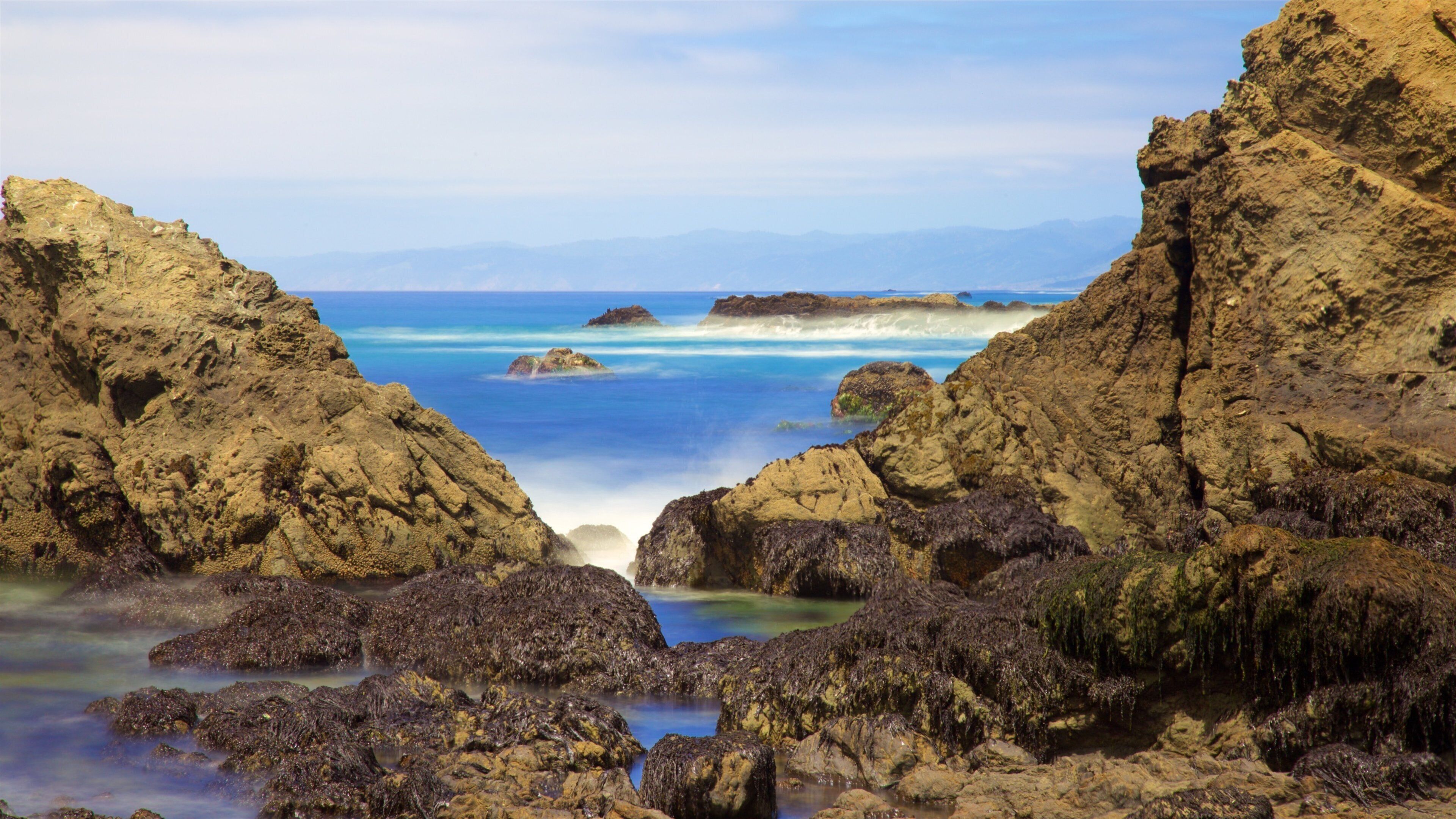 Glass Beach which includes general coastal views and rugged coastline