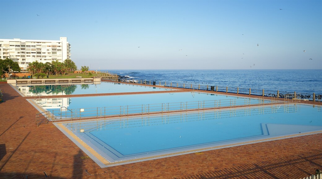 Sea Point Swimming Pool which includes general coastal views, a pool and a coastal town