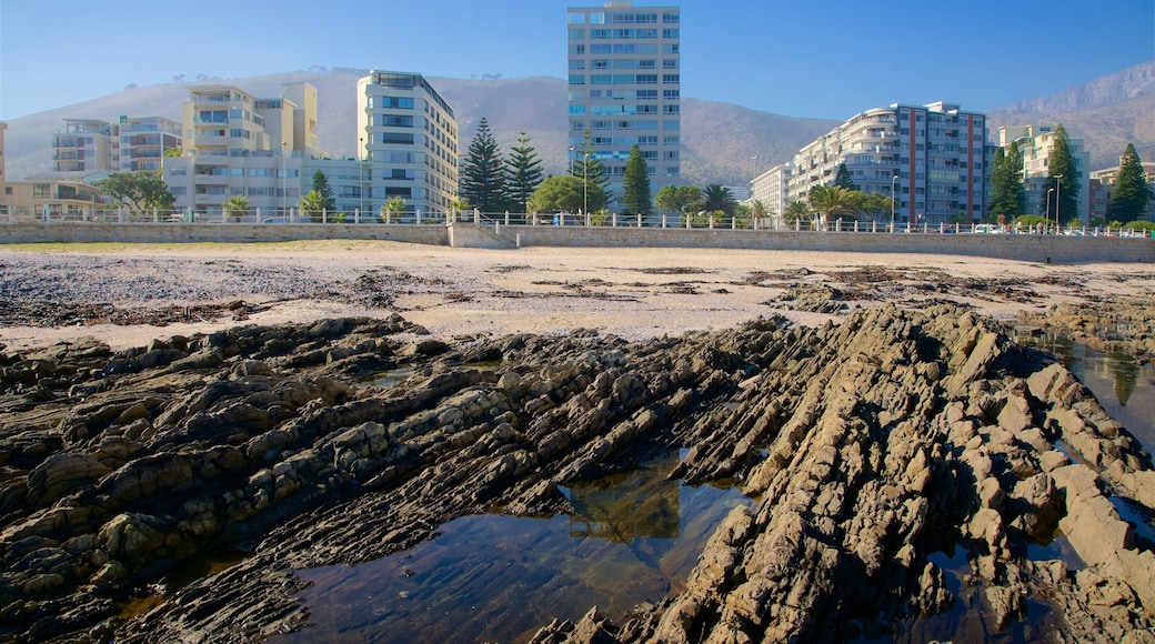 Milton Beach featuring a city and rugged coastline