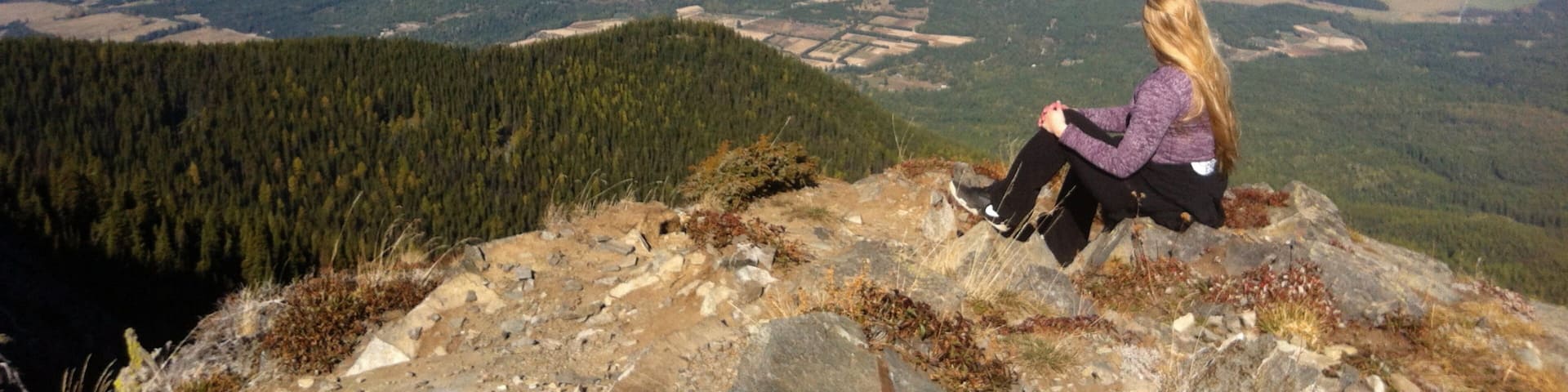 Bonners Ferry showing mountains as well as an individual femail