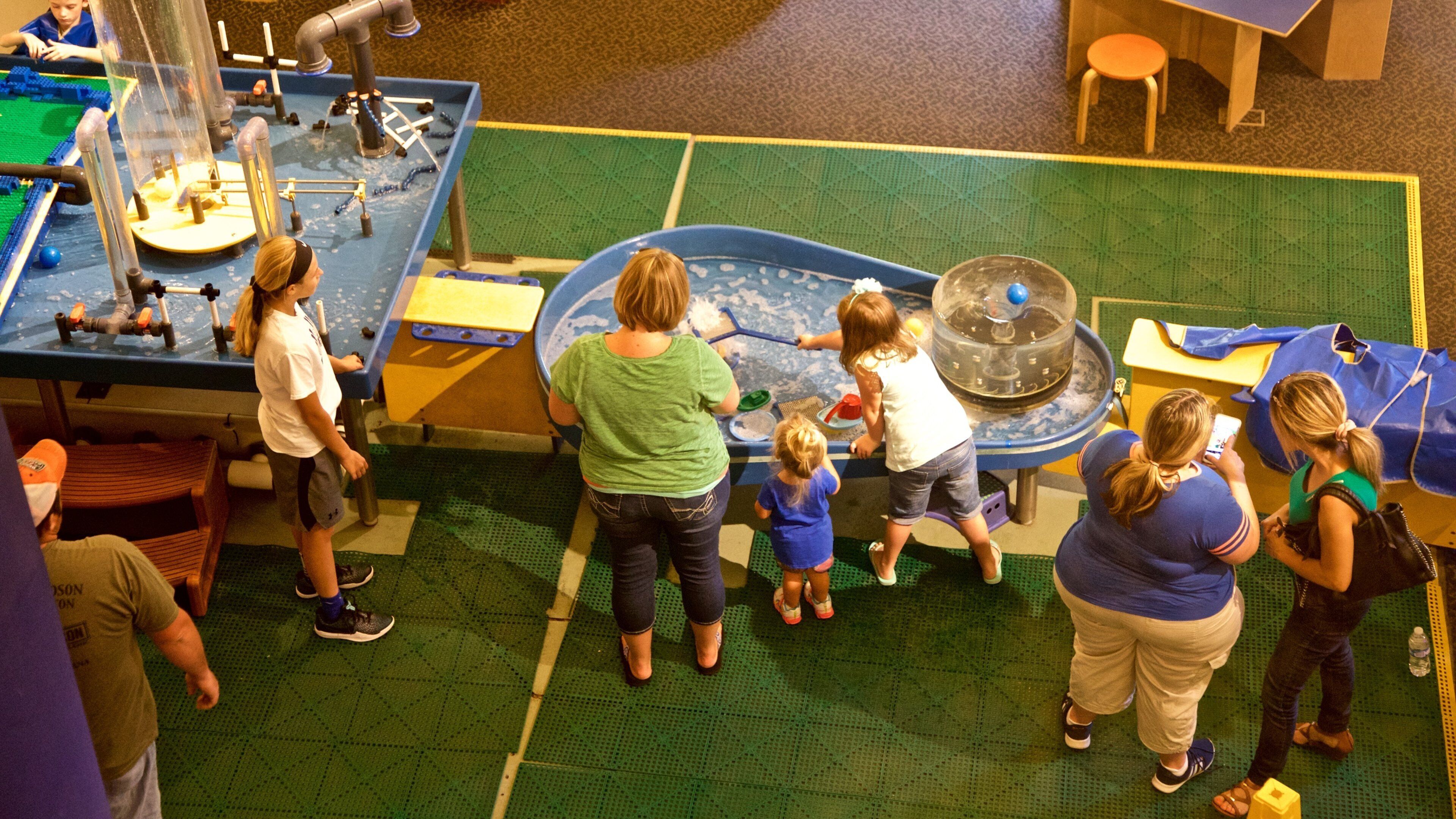 Wonderlab Science Museum featuring interior views as well as a small group of people
