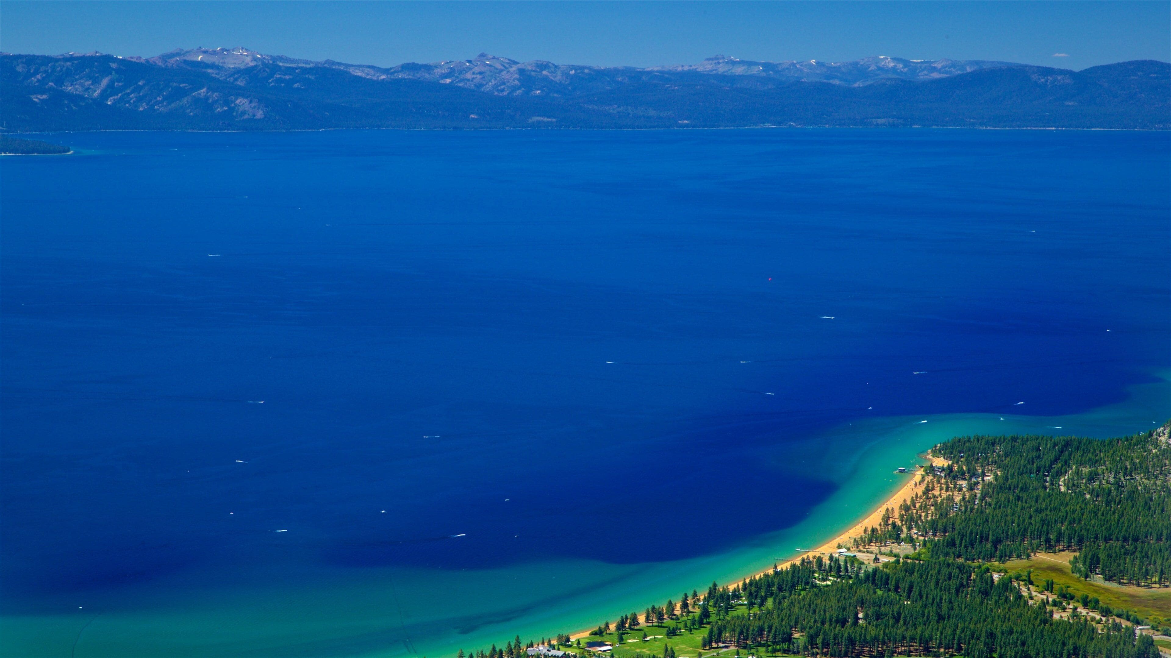 Heavenly Mountain Gondola which includes tranquil scenes, a beach and a lake or waterhole